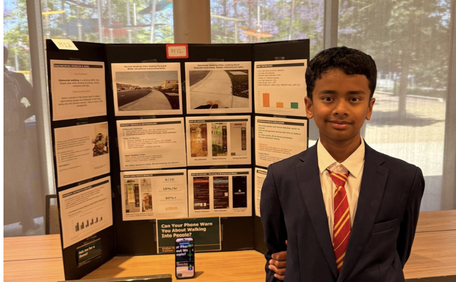 Krishav standing beside his NoBonk project display, with the app running on a phone
